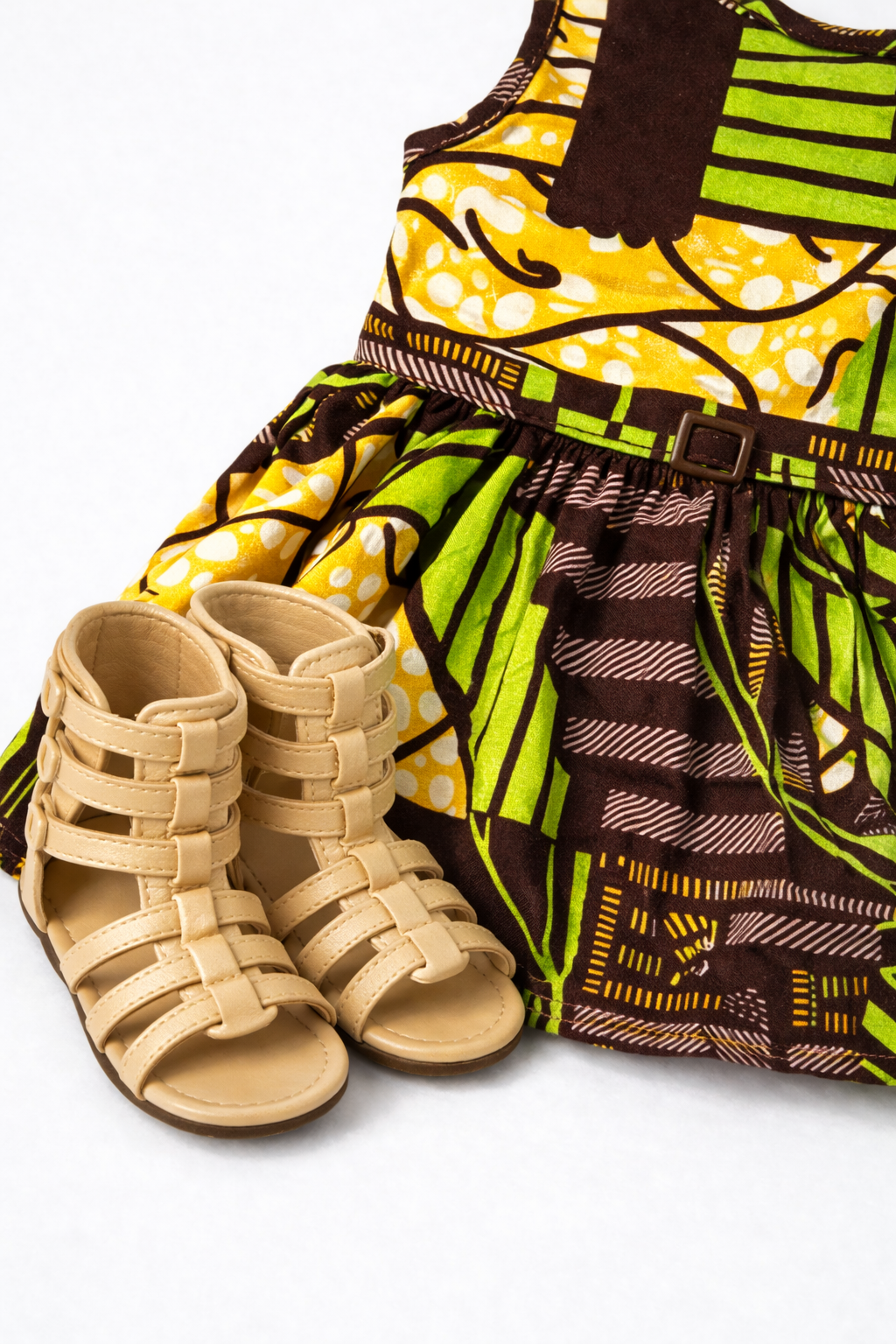 Close-up of African print doll dress with matching sandals for 18-inch dolls inspired by Future Lawyer Khari