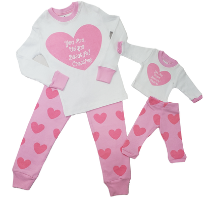 Girls pajama set with pink heart print and positive affirmation design, soft cotton sleepwear for kids